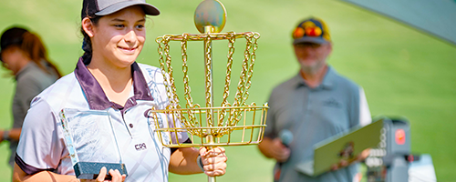 A child with their trophies after winning
